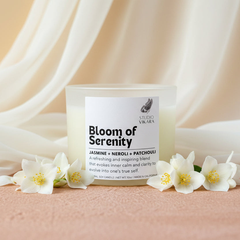Candle labeled 'Bloom of Serenity' by Studio Vikara on a beige background