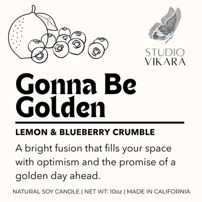 Label for 'Gonna Be Golden' lemon & blueberry crumble candle by Studio Vikara with illustrations of fruits and a butterfly.