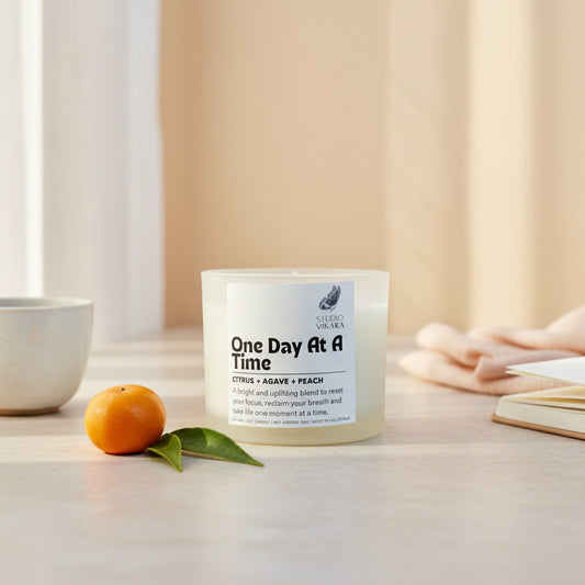 Candle with a label on a beige background