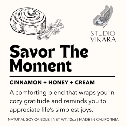 Candle packaging with cinnamon roll illustration and 'Studio Vikara' branding.