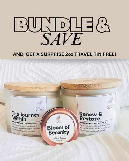 Two big jars of candle and a small rose gold tin candle arranged on a luxury bed