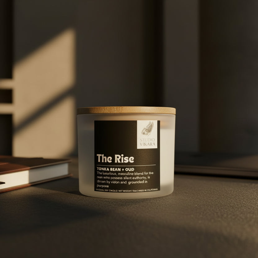 Candle jar labeled 'The Rise' by Studio Vikara on a beige background