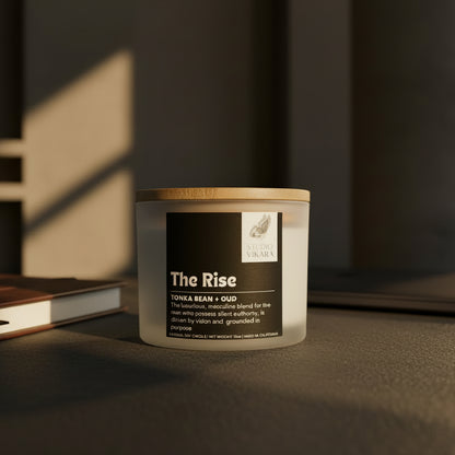 Candle jar labeled 'The Rise' by Studio Vikara on a beige background